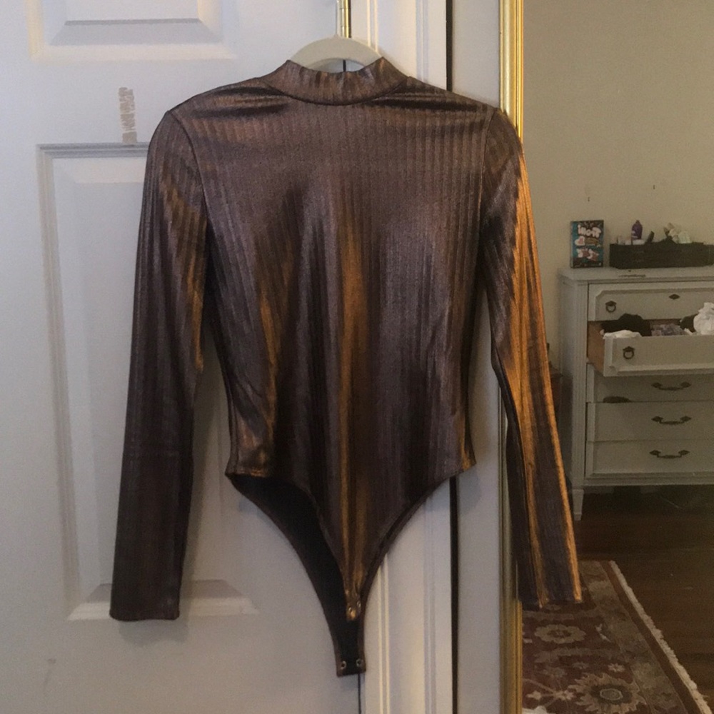 Bronze body suit.